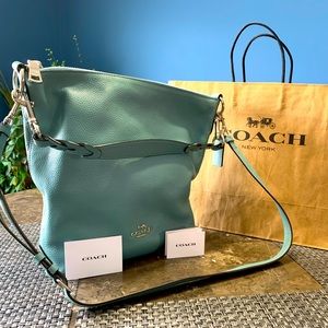 COACH Duffle in robin egg blue. Convertible strap. Like new! Spring is calling!